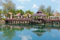 Bridge with flowers across the bay in a tropical garden