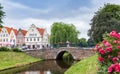 Bridge and flowers at the canal in Friedrichstadt Royalty Free Stock Photo