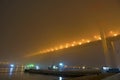 Bridge in the fog, over the Bay. Royalty Free Stock Photo