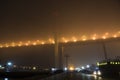 Bridge in the fog, over the Bay. Royalty Free Stock Photo