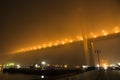 Bridge in the fog, over the Bay. Royalty Free Stock Photo