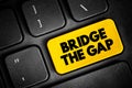 Bridge The Gap - connect two things or to make the difference between them smaller, text concept button on keyboard