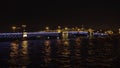 Bridge with illumination over the river at night