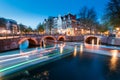 A bridge with lights over the Keizersgracht Canal