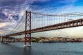 Bridge in Lisbon during sunset, Portugal skyline and cityscape on the Tagus River Royalty Free Stock Photo