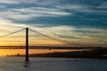 Bridge in Lisbon during sunset, Portugal skyline and cityscape on the Tagus River Royalty Free Stock Photo