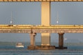 A bridge lit by evening light over the Mandovi river in the city of Panaji