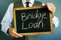 Bridge loan written on a blackboard Royalty Free Stock Photo