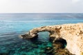 Bridge of Lovers rock formation on the rocky shore of the Mediterranean sea on the island of Cyprus Ayia NAPA. Royalty Free Stock Photo