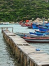 The bridge and many boats the Hon Khoi pier in Khanh Hoa, Vietnam Royalty Free Stock Photo