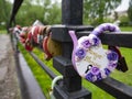 Bridge with many locks with the names of the newlyweds as a sign of love. Hard padlocks with keys thrown into the river are a