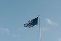 Bridge Mark flag on Tower Bridge, London, UK, against blue sky