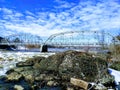 A bridge of metal structure over a river Royalty Free Stock Photo