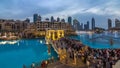 The bridge near the biggest musical fountain in Dubai day to night . Dubai, UAE Royalty Free Stock Photo