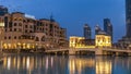 The bridge near the biggest musical fountain in Dubai day to night timelapse. Dubai, UAE Royalty Free Stock Photo