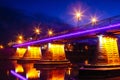 Bridge night city reflected in water Uzhorod