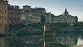A bridge and old riverfront buildings in Florence, Italy