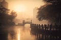 a bridge over a body of water with a city skyline in the background in the foggy morning hours in the foreground is a bridge with Royalty Free Stock Photo