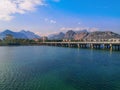 Bridge over the Boga Stream River on Ataturk Boulevard in Antalya and the Taurus Mountains on the horizon. Amazing cityscape of