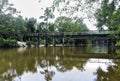 A bridge over the Bogue Falaya River in a forest with a landing