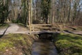 Bridge over a brook in a forest Royalty Free Stock Photo