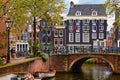 Bridge over channel in Amsterdam Netherlands houses river Amstel Royalty Free Stock Photo