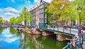 Bridge over channel in Amsterdam Netherlands houses river Amstel Royalty Free Stock Photo