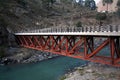Bridge over deep green river Beas in remote rural Royalty Free Stock Photo