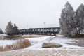 Bridge over fishing lake on freezing day