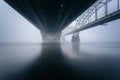 Bridge over foggy river Royalty Free Stock Photo