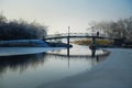 Bridge over the frozen lake Royalty Free Stock Photo