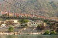 Bridge over Ganga river, Ram Jhula, Rishikesh. People crossing Ram Jhula bridge Royalty Free Stock Photo