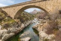 Bridge over Golo river with Mount Albanu in distance Royalty Free Stock Photo