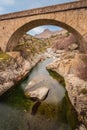 Bridge over Golo river with Mount Albanu in distance Royalty Free Stock Photo