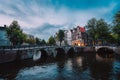 Bridge over Keizersgracht Emperor`s canal in Amsterdam, dutch scene at twilight, Netherlands Royalty Free Stock Photo