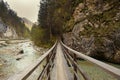 Bridge over a mountain stream. Autumn view of Slovenia, toning