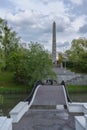 Bridge over pond in park of Victory and Monument to 1200 guardsmen