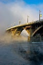 Bridge over river Angara in the fog Royalty Free Stock Photo