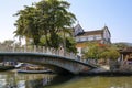 View to bridge over river Pereque-Acu with trees and an old church in the background, in historic town Paraty, Brazil Royalty Free Stock Photo