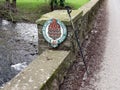 Bridge over a river in the Brecon Beacons, Wales with National Park sign