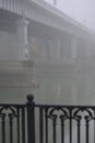 Bridge over the river in the fog. Lonely man under the bridgeÃÂ¼ Royalty Free Stock Photo