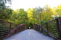 A bridge over a river with metal railing and lush green trees at the Chattahoochee River National Recreation Area Royalty Free Stock Photo