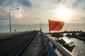 Bridge over river, sea morning sun rise, boat, elephant flag Thailand Royalty Free Stock Photo