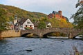 Bridge over the Rur in Heimbach and castle Hengebach in the background Royalty Free Stock Photo