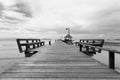Bridge over the sea during ebb tide in black and white Royalty Free Stock Photo