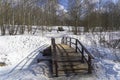 A bridge over a stream at the bottom of a small ravine Royalty Free Stock Photo