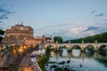 Bridge over the Tiber River near the Castle of Angel - Vatican prison at sunset on an evening summer day in Rome, Italy Royalty Free Stock Photo
