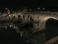 Bridge over the Tiber River at night, Rome, Italy