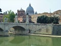 Bridge over the Tiber river in Rome with Saint Peters Basilica Royalty Free Stock Photo