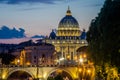 The bridge over the Tiber River and the Vatican dome at sunset in the evening in a summer day in Rome, Italy Royalty Free Stock Photo